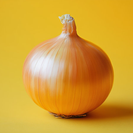 Fresh golden onion on vibrant background, nature s bounty for healthful vegetarian cuisine useの素材