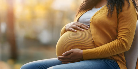 Intimate African American Family Moment Expectant Mother Embraced by Loving Hands During Pregnancyの素材