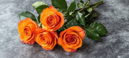 Stunning Floral Arrangement of Orange Roses and Greenery Creating a Romantic and Elegant Atmosphereの素材