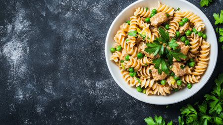 Delicious Spiral Pasta Delight Plate with Green Peas, Tender Meat, and Fresh Parsley Garnishの素材