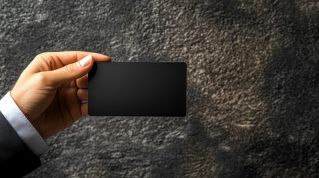 Elegant and Modern Handheld Mockup Object on a Stony Surface, Perfect for Business and Marketing Useの素材