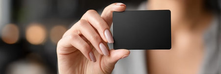 Elegant woman showcasing blank shiny cardboard for business opportunities and presentations concept.の素材