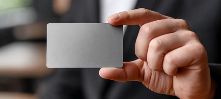 Elegant Minimalist Display of a Blank Gift Card on a Modern Table for Business Event or Meetingの素材