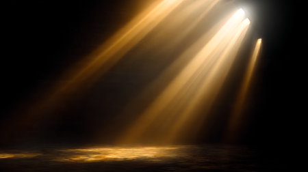 Golden light rays illuminating a mystical atmosphere in a dark room with an unseen window source.の素材