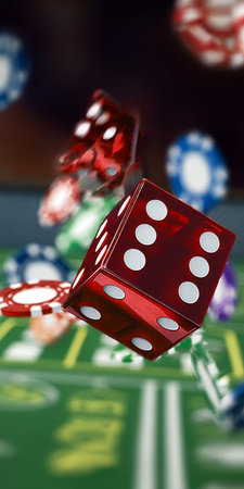 Colorful Dice Rolling Across a Casino Table Surrounded by Chips, Capturing the Thrill of Gamblingの素材