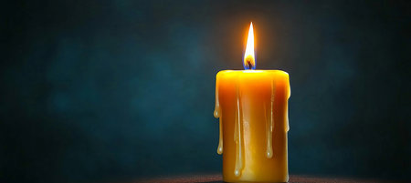 A Golden Candlelight Illuminates the Darkness, Symbolizing Hope, Warmth, and Remembrance in Life.の素材