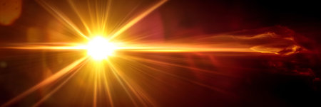 Dramatic Radiant Burst of Golden Light Emanating into Darkness with a Stunning Sun Flare Designの素材