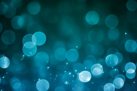 Abstract Sparkling Teal Bokeh Background with Glowing Light Particles and Smooth Gradient Effectの素材