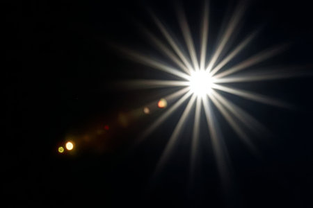 Radiant Light and Ethereal Beauty A Celestial Realm of Bright Stars and Glimmering Flares in Blackの素材