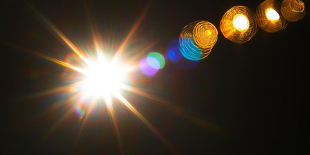 Bright Sunny Burst and Bokeh Effect with Sparkling Golden Lights and Warm Magical Atmosphereの素材