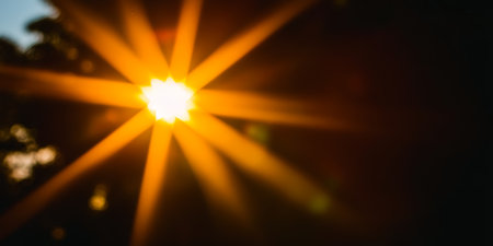 Golden Sunburst Illumination Radiating Rays with Blurred Glow Effect and Vivid Abstract Energyの素材