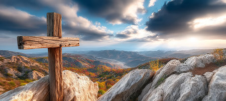 Rustic Wooden Cross Silhouette Against Dramatic Sky Background Symbolizing Faith and Spiritualityの素材