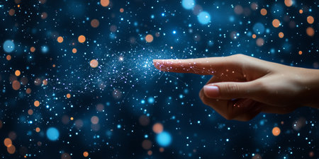 A Hand Reaching Out to a Magical Light in a Starry Sky, Connecting with the Universe s Mystiqueの素材