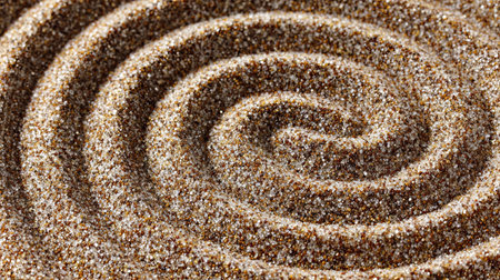 Close-Up of Smooth Light Sand Pebbles Forming a Zen-Inspired Natural Curved Line Texture Backgroundの素材