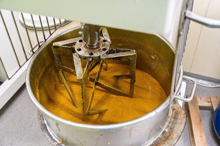 Industrial Mixer Blending Bee Honey A Sweet and Sticky Process in Food Productionの写真素材