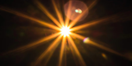 Stylish Sunlight Burst Background Effect with Majestic Golden Light Rays Shining Brightlyの素材