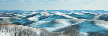 Breathtaking Winter Landscape Snow-Covered Rolling Hills Under a Clear Blue Sky at Duskの素材