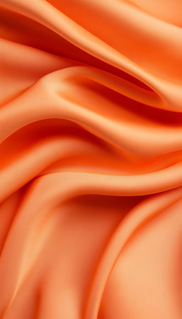 Elegant Smooth Fabric Texture with Gentle Waves and Pearl Transitions in Soft Orange Backgroundの素材