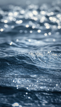 Stunning Ocean Surface Reflection of Sunlight with Beautiful Bokeh and Gentle Rippling Waves Textureの素材
