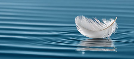 Floating Feather A Serene Plume Dancing Above Calm Waters with Reflections and Gentle Ripplesの素材