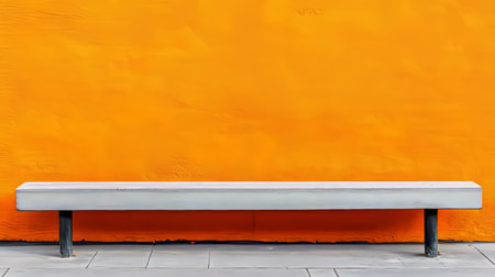 Urban Minimalism A Stark Bench Against a Vibrant Wall Offering Solace in Concrete and Textureの素材