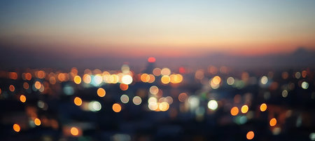 Dreamy Night Cityscape with Soft Blur, Defocused Downtown Lights, and Vibrant Skyline at Sunsetの素材