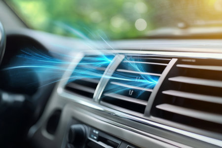 Modern Automotive Climate Control Panel with Blue Glow and Dashboard Cooling Vent Detailsの素材