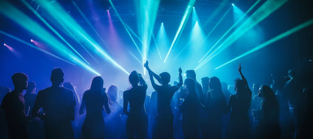 Vibrant Nightclub Atmosphere with Ecstatic Crowd and Colorful Laser Beams Celebrating Togetherの素材