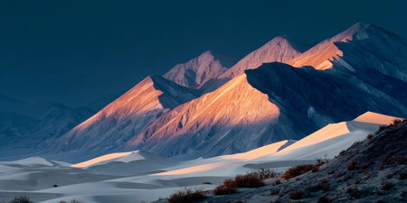 Breathtaking Sunset Over the Expansive Sand Dunes and Rugged Mountains of Death Valley National Parkの素材