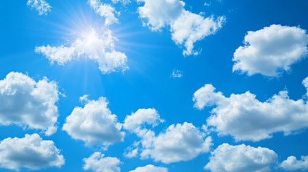 Vibrant Blue Summer Sky with Fluffy White Clouds Creating a Serene Landscape and Natural Beautyの素材