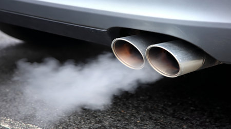 Car Exhaust Emissions Harmful Fumes and Smog Released from Automobile Exhaust Pipes into Airの素材
