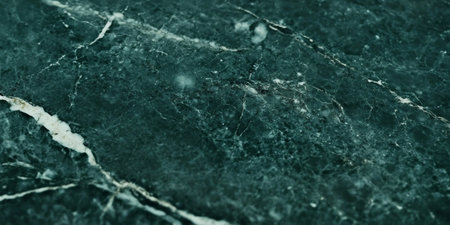 Elegant Dark Green Marble with Distinctive White Veins Running Across the Smooth Stone Surfaceの素材