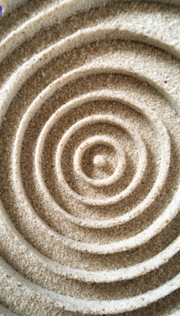 Elegant Zen Garden Pattern Featuring Spiral Design in Beige Sand for Minimalist Meditation Aestheticの素材