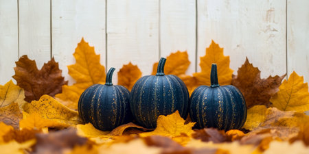 Vibrant Autumn Still Life Featuring Colorful Pumpkins, Fallen Leaves, and Rustic Wooden Surfaceの素材