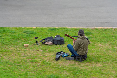 Guitarist Performing Outdoors A Musician s Creative Expression in a Public Park Setting