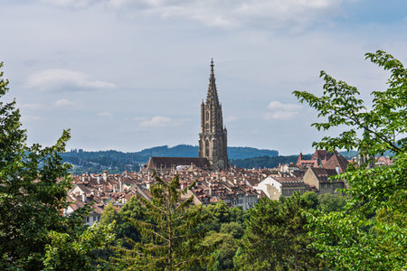 Bern, Switzerland Scenic View of Old City with Towering Cathedral under Cloudy Sky