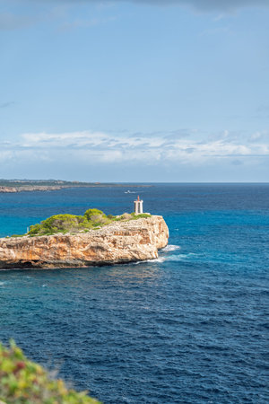 Idyllic Coastal Scenery Lighthouse on Rocky Islet in Azure Sea, Serene Mediterranean Vista