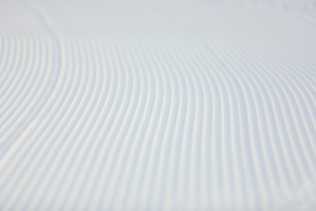 snow pattern on the ski slope after the work of a special machineの写真素材