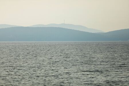 early morning view of the lake and mountains in the farの写真素材
