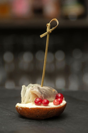 Buffet canape with salted herring and butter