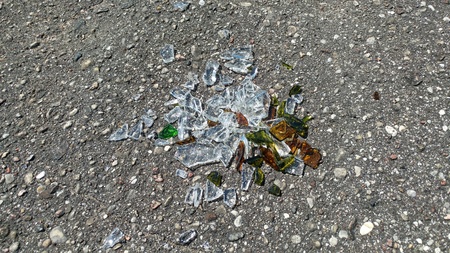 broken glass fragments on the cement texture