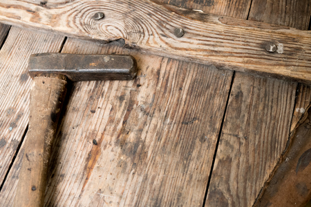 Worn hammer on woodの写真素材
