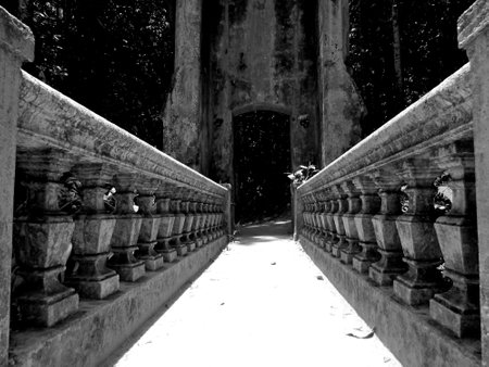 Black and white photo of an old stone bridge in the park.の写真素材