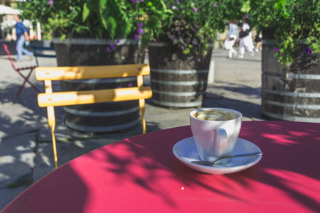 One Coffee Cup with Walking Pedestrians in the Backgroundの写真素材