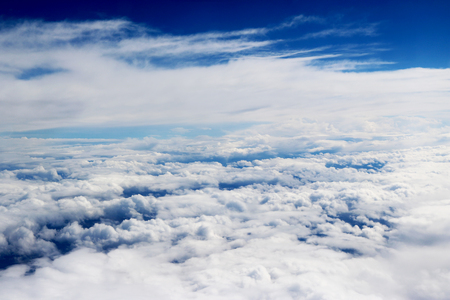 Clouds seen from an airplane, blue sunshine, soil background nature landscapeの写真素材