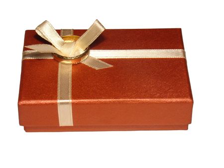 The photo shows a gold ring on a box.の写真素材