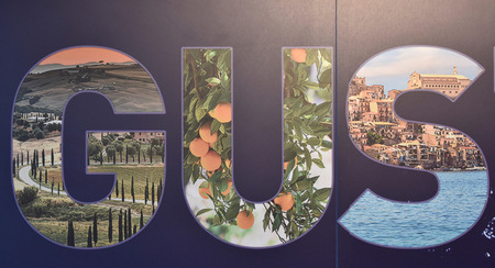Filled letters with collage on blue background.