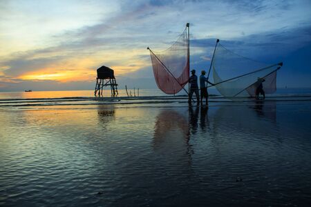 Artwork: fishermen catch fish by net (Viet Nam)の写真素材