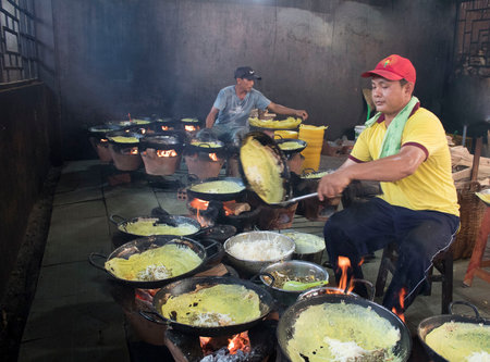 This is a series of photos, the author captures Ask bakers in Binh Thuan Province, Vietnam. Ask cake is often used in the worshiping ceremony, at the temple, or the family. This is a very popular dishのeditorial素材