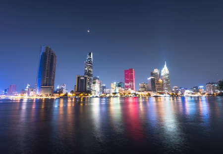 The author takes pictures at the river bank of district two (Ho Chi Minh City). The author takes a...